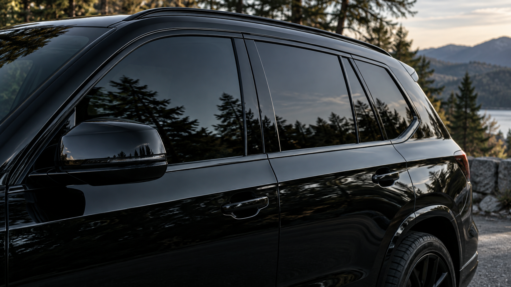 Dark tinted windows on a black SUV